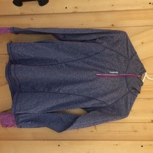 Woman’s Athletic top by Reebok.